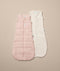 Flatlay of ergoPouch Sleeping Sack 2.5 TOG Daisies and 1.0 TOG Oatmeal Marle, ideal for Spring