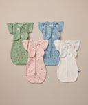 Flatlay of a newborn essential starter kit including ergoPouch Cocoon Swaddle Sack 1.0 TOG and Butterfly Cardi in heritage colors Willow, Daisies, Dragonflies and Oatmeal Marle 