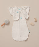Flatlay of a newborn essential starter kit including ergoPouch  White Noise Machine, Cocoon Swaddle Sack 1.0 TOG and Butterfly Cardi in Oatmeal Marle