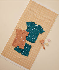 Flatlay of ergoPouch Short Sleeve Pajamas 0.2 TOG Ocean Blue and Short Sleeve Romper Sunny
