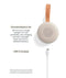 A beige, circular Drift Away White Noise Machine with a tan carrying strap is positioned above a white charging cable against a white background. Text overlay highlights 