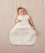 Baby sleeping with arms out in a ergoPouch Hip Harness Cocoon Swaddle Sack 2.5 TOG Oatmeal Marle