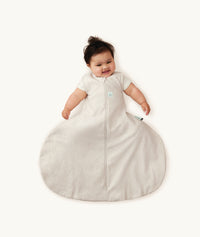 Baby in ergoPouch Hip Harness Sleep Sack 1.0 TOG Oatmeal Marle, with hip dysplasia