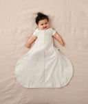 Smiling baby in cool Hip Harness Sleep Sack 0.2 TOG Oatmeal Marle
