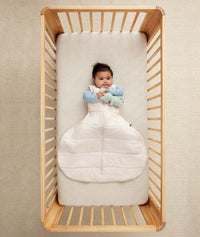 Baby with hip dysplasia in ergoPouch Hip Harness Sleep Sack 2.5 TOG Oatmeal Marle