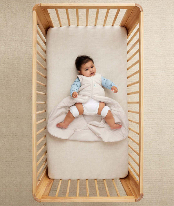 Baby with hip dysplasia in hip-harness-sleep-sack-2-5-tog-oatmeal-marle