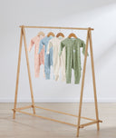 Flatlay of ergoPouch Long Sleeve Romper 1.0 TOG Daisies, Dragonflies, Oatmeal Marle and Willow