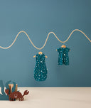 Product shots of ergoPouch Cocoon Swaddle Sack 0.2 TOG and Long Sleeve Romper in Ocean Blue