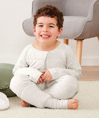 Child sitting in ergoPouch Sleep Onesie 3.5 TOG Grey Marle, warm for the winter