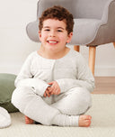 Child sitting in ergoPouch Sleep Onesie 2.5 TOG Grey Marle, warm for the winter