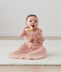 Infant wearing ergoPouch Sleeping Sack 1.0 TOG Daisies