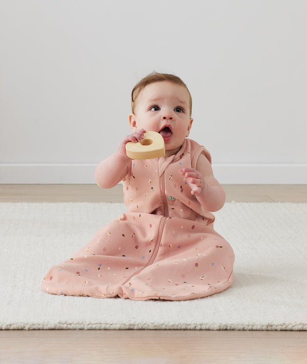 Infant wearing ergoPouch Sleeping Sack 1.0 TOG Daisies