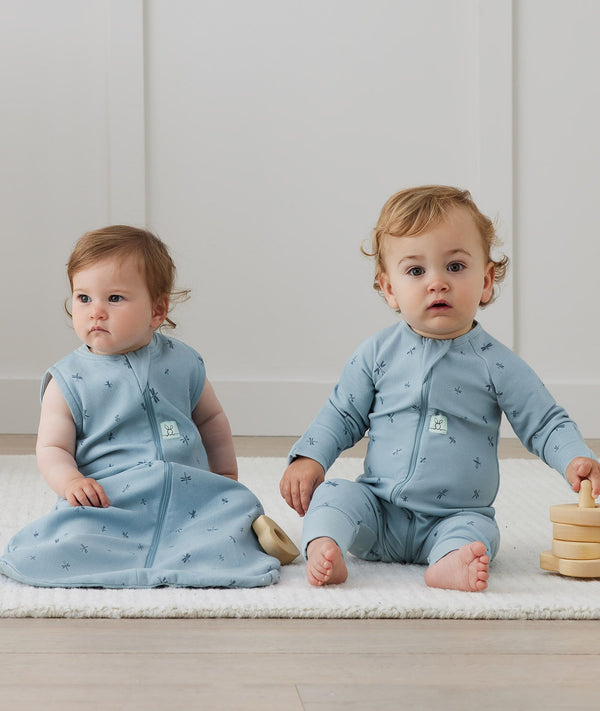 Two babies in ergoPouch Sleep Sack 0.2 TOG and Long Sleeve Layer in Dragonflies