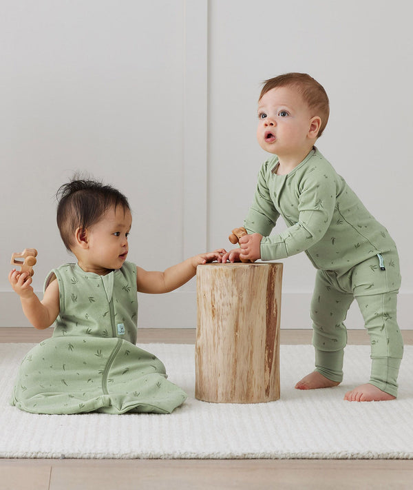 Infants playing wearing ergoPouch Sleep Sack in Willow