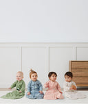 Four babies in ergoPouch Heritage collection Sleep Sacks