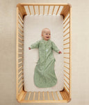Infant wearing ergoPouch Sleep Sack in Willow