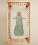 Infant wearing ergoPouch Sleep Sack in Willow