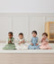 Four infants sitting in ergoPouch Sleeping Sack 2.5 TOG Daisies, Oatmeal Marle, Willow and Dragonflies