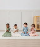 Four babies in ergoPouch Heritage collection Sleep Sacks