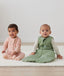Infants wearing ergoPouch Sleep Sack 2.5 TOG in Willow and ergoPouch Long Sleeve Romper in Daisies