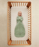 Infant wearing ergoPouch Sleep Sack in Willow