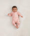 Newborn wearing an ergoPouch Long Sleeve Romper 0.2 TOG Berries