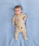 Newborn lying on its back wearing ergoPouch Long Sleeve Romper 0.2 TOG in Birthday Blobs