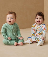 Two babies sitting in ergoPouch Long Sleeve Romper 1.0 TOG Sweet Orchard and Fruit Salad