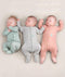 Three newborns wearing an ergoPouch Long Sleeve Romper 0.2 TOG in different colours