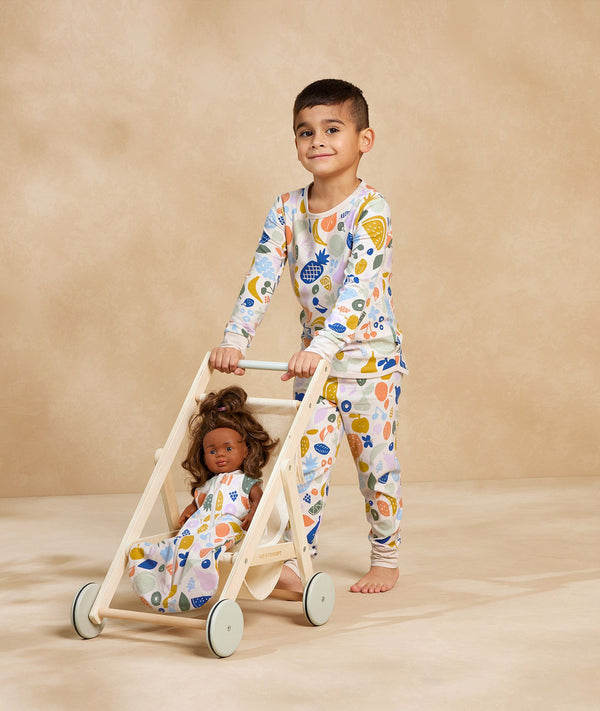 Kid playing in long-sleeve-pyjamas-1-0-tog-fruit-salad