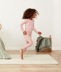Child running in a comfy long-sleeve-pajamas-1-0-tog-berries
