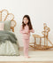 Toddler standing in a comfy long-sleeve-pajamas-1-0-tog-berries