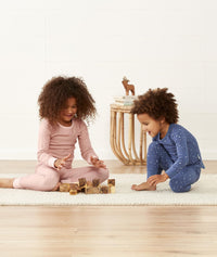 Two toddlers playing in long-sleeve-pajamas-1-0-tog-berries and Night Sky