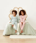 Two toddlers sitting in long-sleeve-pajamas-1-0-tog-berries and Sage