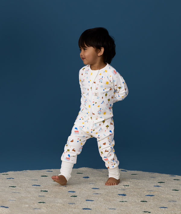 Toddler wearing ergoPouch Long Sleeve Romper 1.0 TOG Daydream