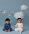 Two children sitting in ergoPouch Long Sleeve Romper 1.0 TOG Daydream and Starbeam