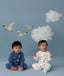 Two children sitting in ergoPouch Long Sleeve Romper 1.0 TOG Daydream and Starbeam