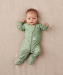 Newborn lying wearing ergoPouch Long Sleeve Romper 1.0 TOG Willow