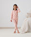 Kid wearing ergoPouch Long Sleeve Pajamas 1.0 TOG Daisies