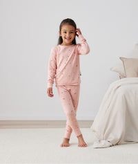 Child standing in long-sleeve-pajamas-0-2-tog-daisies