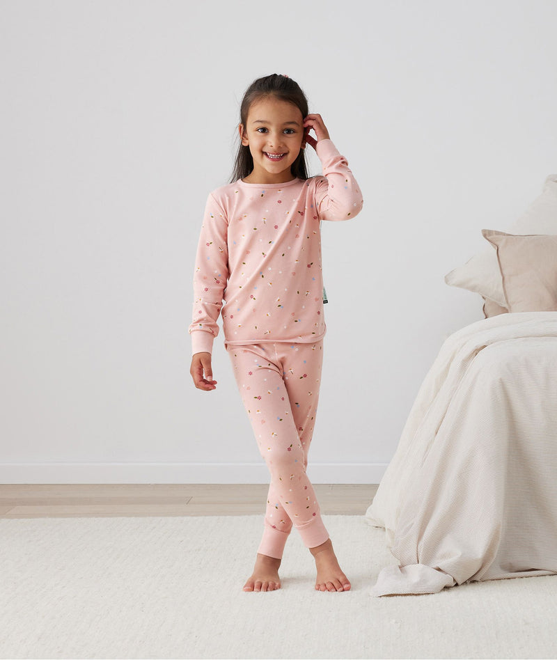 Child standing in long-sleeve-pajamas-0-2-tog-daisies