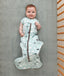 Infant lying on  a crib wearing a premium sleep sack 0.3 tog
