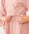 Close up of a woman tightening the robe of an ergoPouch Matchy Matchy Robe Berries