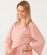 Woman smiling wearing an ergoPouch Matchy Matchy Robe Berries