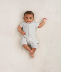 Newborn wearing an ergoPouch Short Sleeve Romper 0.2 TOG Grey Marle