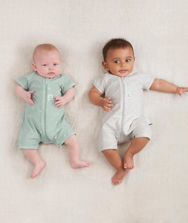 Two newborns ergoPouch Short Sleeve Romper 0.2 TOG Grey Marle and Sage, ideal for the summer