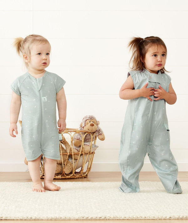 Toddlers standing wearing a ergoPouch Short & Long Sleeve Romper in Sage