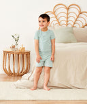 Preschooler wearing ergoPouch Short Sleeve Pajamas 0.2 TOG Sage