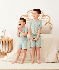 Toddler and Preschooler wearing ergoPouch Short Sleeve Pajamas in Sage