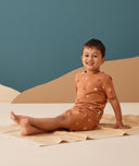 Preschooler wearing ergoPouch Short Sleeve Pajamas 0.2 TOG Sunny